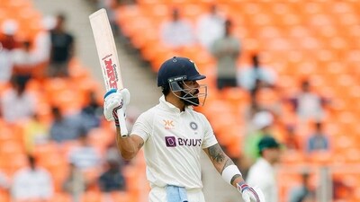 India's Virat Kohli raises his bat after completing his century during the fourth day of the 4th test match against Australia, at Narendra Modi Stadium. (ANI) India's Virat Kohli raises his bat after completing his century during the fourth day of the 4th test match against Australia, at Narendra Modi Stadium. (ANI)