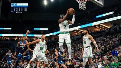 Boston Celtics forward Jaylen Brown (7) pulls down a rebound against the Minnesota Timberwolves in the second half at Target Center. (USA TODAY Sports)