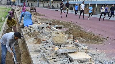Construction work of track at Guru Nanak Stadium, Ludhiana, in progress on Thursday. (Gurpreet Singh/HT photo) Construction work of track at Guru Nanak Stadium, Ludhiana, in progress on Thursday. (Gurpreet Singh/HT photo)