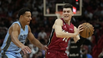 Miami Heat guard Tyler Herro (14) looks to pass under pressure from Memphis Grizzlies guard Desmond Bane (22). (AP) Miami Heat guard Tyler Herro (14) looks to pass under pressure from Memphis Grizzlies guard Desmond Bane (22). (AP)