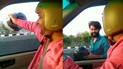 Man gives free helmet to biker on Lucknow expressway. (Twitter/@@helmet_man_) Man gives free helmet to biker on Lucknow expressway. (Twitter/@@helmet_man_)