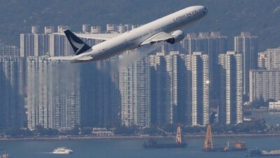 FILE PHOTO: A Cathay Pacific aircraft takes off at the airport, during the coronavirus disease (COVID-19) pandemic in Hong Kong, China, March 31, 2022. REUTERS/Tyrone Siu/File Photo (REUTERS)