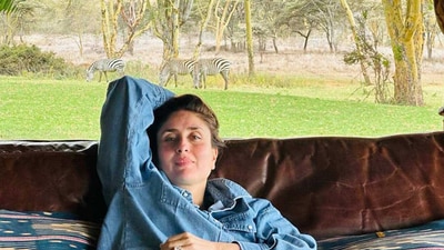 Kareena Kapoor relaxes on a couch with zebras grazing behind her. Kareena Kapoor relaxes on a couch with zebras grazing behind her.