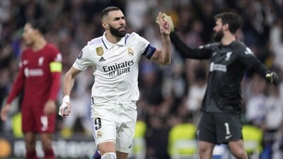 Real Madrid's Karim Benzema celebrates after scoring his sides first goal during the Champions League, round of 16, second leg soccer match between Real Madrid and Liverpool at the Santiago Bernabeu stadium in Madrid, Spain, Wednesday, March 15, 2023. (AP Photo/Bernat Armangue) (AP) Real Madrid's Karim Benzema celebrates after scoring his sides first goal during the Champions League, round of 16, second leg soccer match between Real Madrid and Liverpool at the Santiago Bernabeu stadium in Madrid, Spain, Wednesday, March 15, 2023. (AP Photo/Bernat Armangue) (AP)