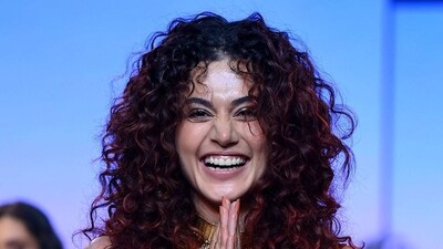 Taapsee Pannu presents a creation by designer Monisha Jaising during the Lakme Fashion Week x FDCI, in Mumbai. (AFP) Taapsee Pannu presents a creation by designer Monisha Jaising during the Lakme Fashion Week x FDCI, in Mumbai. (AFP)