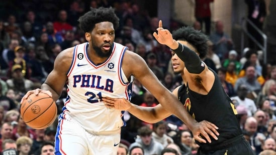 Joel Embiid #21 of the Philadelphia 76ers drives around Isaac Okoro #35 of the Cleveland Cavaliers during the first half of the game at Rocket Mortgage Fieldhouse. (Getty Images via AFP)
