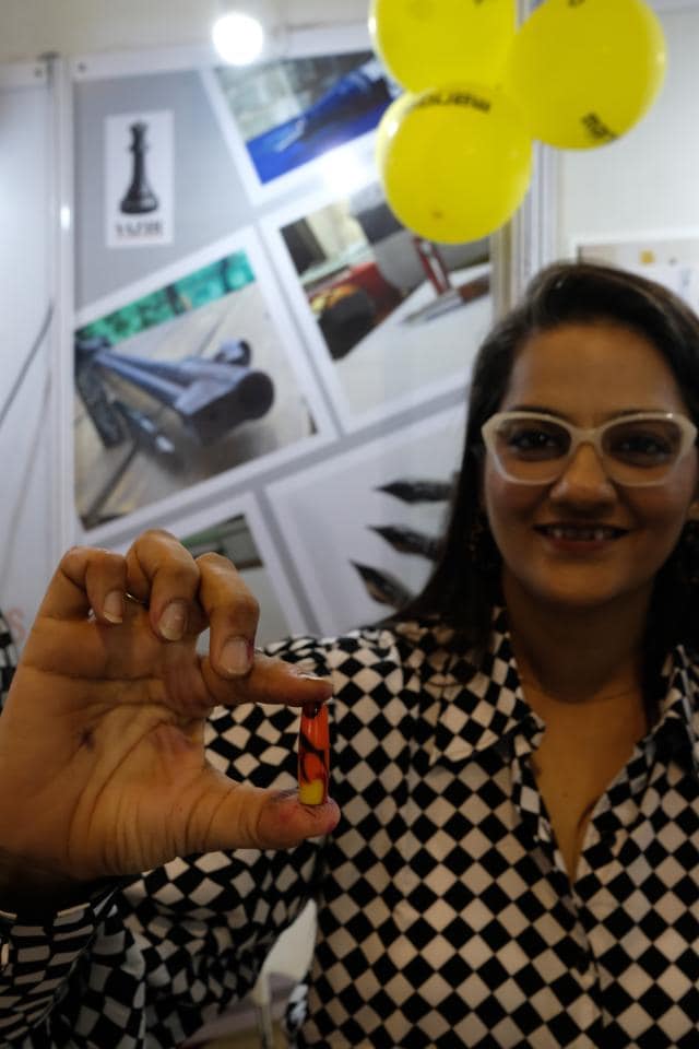 Nisha Singhi holds up a fountain pen that is possibly the smallest in the world. Made of acrylic by her company Vazir Fountain Pens, this one takes a small dribble of ink, which, Singhi says, is “good enough for fifty signatures or a page.” (Suhit Bombaywala) Nisha Singhi holds up a fountain pen that is possibly the smallest in the world. Made of acrylic by her company Vazir Fountain Pens, this one takes a small dribble of ink, which, Singhi says, is “good enough for fifty signatures or a page.” (Suhit Bombaywala)