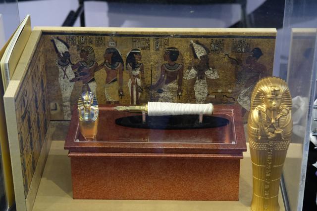 Lying in state with its trappings, the limited edition “Tutankhamun” by Montegrappa. At left, the cap of the pen; middle, the pen recalls a swaddled mummy; at right, the case shaped like a sarcophagus. (Suhit Bombaywala) Lying in state with its trappings, the limited edition “Tutankhamun” by Montegrappa. At left, the cap of the pen; middle, the pen recalls a swaddled mummy; at right, the case shaped like a sarcophagus. (Suhit Bombaywala)