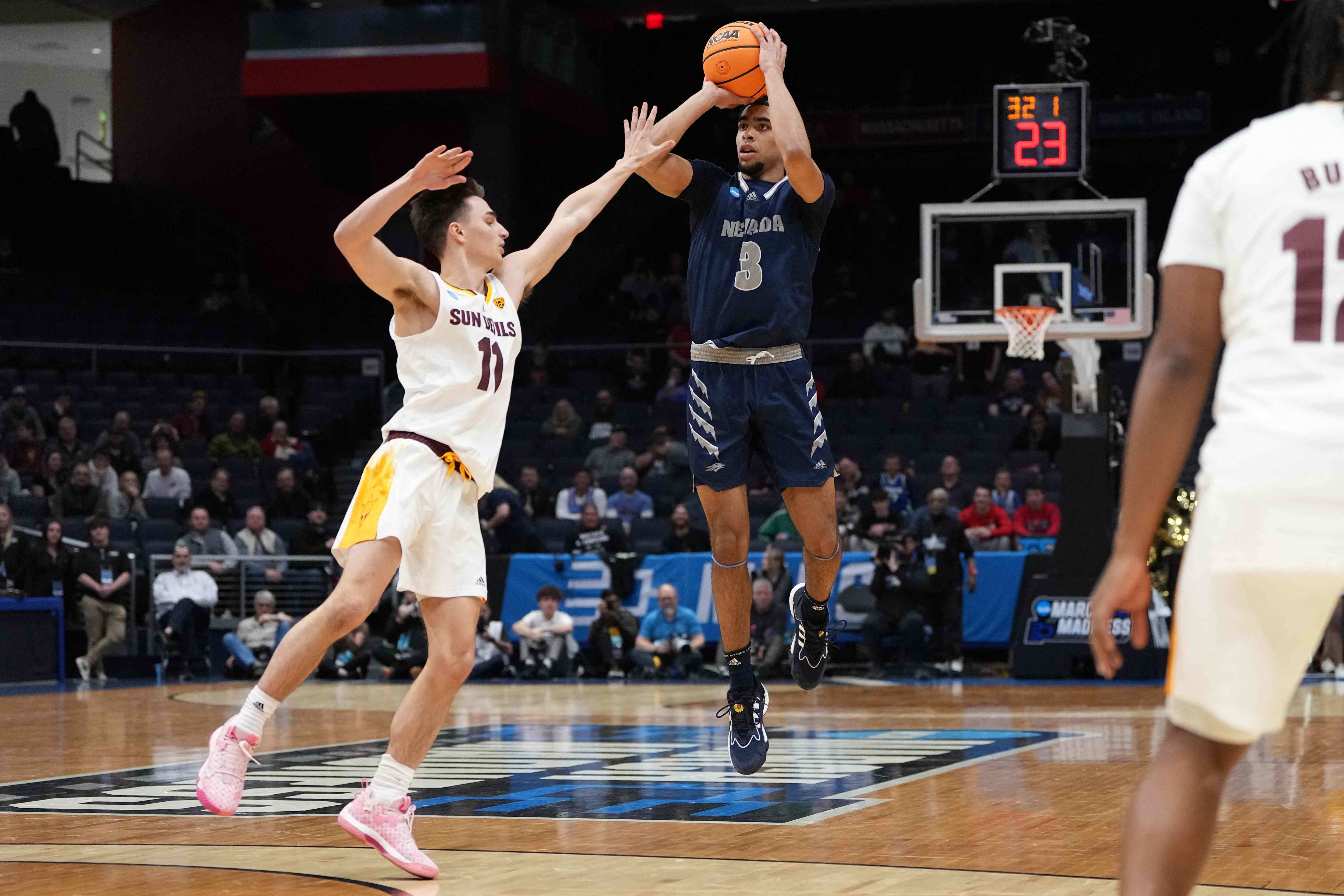 Trey Pettigrew #3 of the Nevada Wolf Pack shoots the ball against Bobby Hurley #11 of the Arizona State Sun Devils during the second half in the First Four game of the NCAA Men's Basketball Tournament at University of Dayton Arena. (Getty Images via AFP) Trey Pettigrew #3 of the Nevada Wolf Pack shoots the ball against Bobby Hurley #11 of the Arizona State Sun Devils during the second half in the First Four game of the NCAA Men's Basketball Tournament at University of Dayton Arena. (Getty Images via AFP)