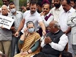 Rahul Gandhi with Congress MPs during a protest over Adani issue at the Parliament House Complex on Friday. Rahul Gandhi with Congress MPs during a protest over Adani issue at the Parliament House Complex on Friday.