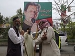 Imran Khan News: Supporters of former Prime Minister Imran Khan gather with sticks near the Khan's residence, in Lahore. Imran Khan News: Supporters of former Prime Minister Imran Khan gather with sticks near the Khan's residence, in Lahore.