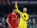 Soccer Football - Europa League - Round of 16 - Second Leg - Real Betis v Manchester United - Estadio Benito Villamarin, Seville, Spain - March 16, 2023  Manchester United's Casemiro and David de Gea celebrate after the match REUTERS/Jon Nazca