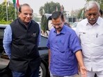Delhi LG VK Saxena (L) being welcomed by Chief Minister Arvind Kejriwal (M) and Speaker Ram Niwas Goel (R).