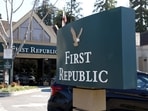 A sign is posted in front of a First Republic Bank.