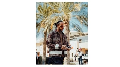 F1 racer Lewis Hamilton wears a silk block-print quilt jacket designed by Gurugram-based menswear designer Kartik Kumra. The self-taught designer launched Karu Research in 2021 and works with handloom weavers from Andhra Pradesh and West Bengal, hand embroiderers from Delhi and West Bengal, and natural dyers from Karnataka and Odisha. He is one of 22 from around the world shortlisted for the 2023 LVMH Prize (which awards young talent with mentorship at the French fashion house and a 300,000-Euro grant). Rapper Kendrick Lamar and singer Joe Jonas have helped bring the 23-year-old into the spotlight. (Courtesy @karuresearch on Instagram) F1 racer Lewis Hamilton wears a silk block-print quilt jacket designed by Gurugram-based menswear designer Kartik Kumra. The self-taught designer launched Karu Research in 2021 and works with handloom weavers from Andhra Pradesh and West Bengal, hand embroiderers from Delhi and West Bengal, and natural dyers from Karnataka and Odisha. He is one of 22 from around the world shortlisted for the 2023 LVMH Prize (which awards young talent with mentorship at the French fashion house and a 300,000-Euro grant). Rapper Kendrick Lamar and singer Joe Jonas have helped bring the 23-year-old into the spotlight. (Courtesy @karuresearch on Instagram)