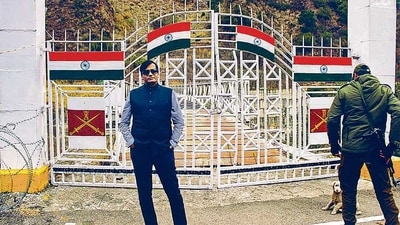 An undated photo of Gujarat conman Kiran Patel with his security. Patel has been arrested for cheating, forgery and impersonation as an as an additional director (strategy and campaigns) in the PMO. (PTI) An undated photo of Gujarat conman Kiran Patel with his security. Patel has been arrested for cheating, forgery and impersonation as an as an additional director (strategy and campaigns) in the PMO. (PTI)