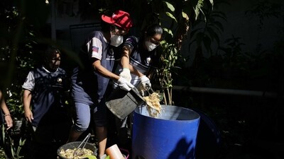 Workers pour organic waste for processing at a recycling facility in Malabon, Philippines. (File) (AP) Workers pour organic waste for processing at a recycling facility in Malabon, Philippines. (File) (AP)