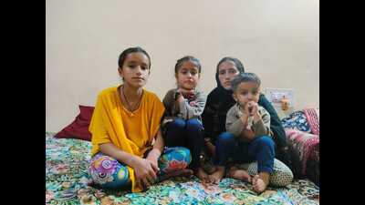 Sunita Sharma, wife of deceased ATM guard Sanjay Sharma, along with her three minor children at a relative’s house in Jammu on Friday.Sanjay was killed by terrorists in Pulwama’s Achan village on February 26. (HT Photo) Sunita Sharma, wife of deceased ATM guard Sanjay Sharma, along with her three minor children at a relative’s house in Jammu on Friday.Sanjay was killed by terrorists in Pulwama’s Achan village on February 26. (HT Photo)