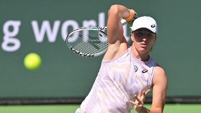 Mar 16, 2023; Indian Wells, CA, USA;  Iga Swiatek (POL) hits a shot as she defeated Sorana Cristea (ROU) in her quarterfinal match in the BNP Paribas Open at the Indian Wells Tennis Garden. Mandatory Credit: Jayne Kamin-Oncea-USA TODAY Sports (USA TODAY Sports)