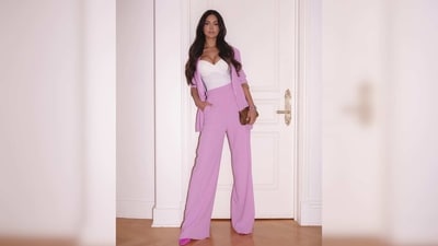 Esha Gupta wore a white bustier top featuring a plunging neckline and paired it with a pink pantsuit.&nbsp; (Instagram/@egupta)