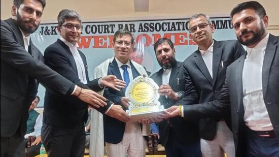 Chief Justice of J&K and Ladakh High Court Justice N Kotiswar Singh being felicitated by Jammu and Kashmir High Court Bar Association president advocate Vikram Sharma and others in Jammu on Friday. (HT Photo)