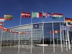 Flags flutter in the wind outside Nato headquarters in Brussels, Belgium. (AP) Flags flutter in the wind outside Nato headquarters in Brussels, Belgium. (AP)