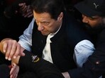 Imran Khan: Security personnel escort former Pakistan's Prime Minister Imran Khan as he arrives to appear at the high court in Lahore. Imran Khan: Security personnel escort former Pakistan's Prime Minister Imran Khan as he arrives to appear at the high court in Lahore.