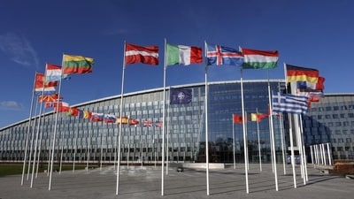Flags flutter in the wind outside Nato headquarters in Brussels, Belgium. (AP) Flags flutter in the wind outside Nato headquarters in Brussels, Belgium. (AP)
