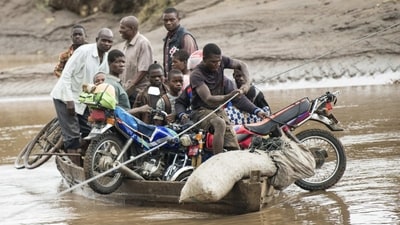 Men are seen transporting their salvaged belongings on a boat in Chiradzulu, southern Malawi on March 17. “A lot of areas are inaccessible restricting movement of assessment and humanitarian teams and life-saving supplies,” said Paul Turnbull, the World Food Program’s director in Malawi, reported AP. (Thoko Chikondi / AP) Men are seen transporting their salvaged belongings on a boat in Chiradzulu, southern Malawi on March 17. “A lot of areas are inaccessible restricting movement of assessment and humanitarian teams and life-saving supplies,” said Paul Turnbull, the World Food Program’s director in Malawi, reported AP. (Thoko Chikondi / AP)