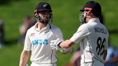 New Zealand's Kane Williamson (L) celebrators 50 runs with team mate Henry Nicholls during day two of the second cricket test match between New Zealand and Sri Lanka at the Basin Reserve in Wellington on March 18, 2023. (Photo by Marty MELVILLE / AFP) (AFP) New Zealand's Kane Williamson (L) celebrators 50 runs with team mate Henry Nicholls during day two of the second cricket test match between New Zealand and Sri Lanka at the Basin Reserve in Wellington on March 18, 2023. (Photo by Marty MELVILLE / AFP) (AFP)