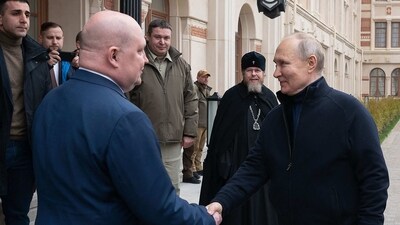 Russian President Vladimir Putin (R) shaking hands with Sevastopol Governor Mikhail Razvozhayev (L) as he visits a children's arts-and-crafts centre, part of Chersonesos Taurica historical and archeological park on the 9th anniversary of the referendum on the state status of Crimea and Sevastopol and its reunification with Russia. (AFP) Russian President Vladimir Putin (R) shaking hands with Sevastopol Governor Mikhail Razvozhayev (L) as he visits a children's arts-and-crafts centre, part of Chersonesos Taurica historical and archeological park on the 9th anniversary of the referendum on the state status of Crimea and Sevastopol and its reunification with Russia. (AFP)