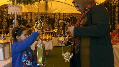 Palestinians shop at a Ramadan lantern or "fanous" stall, ahead of the holy Muslim month, in Hebron city in the occupied West Bank. Ramadan 2023: Here's when Ramzan crescent moon will be sighted in India, Saudi Arabia other countries (Photo by HAZEM BADER / AFP) Palestinians shop at a Ramadan lantern or "fanous" stall, ahead of the holy Muslim month, in Hebron city in the occupied West Bank. Ramadan 2023: Here's when Ramzan crescent moon will be sighted in India, Saudi Arabia other countries (Photo by HAZEM BADER / AFP)