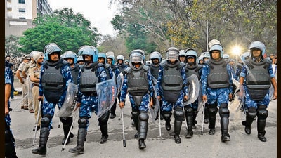 Rapid action force at the protest site at the Airport Road where Nihangs blocked Airport road to support Amritpal Singh at Sohana Light Point in Mohali on Saturday . (Ravi Kumar/ Hindustan Timestan Times) Rapid action force at the protest site at the Airport Road where Nihangs blocked Airport road to support Amritpal Singh at Sohana Light Point in Mohali on Saturday . (Ravi Kumar/ Hindustan Timestan Times)