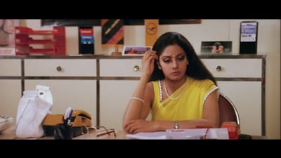 Sridevi, in one of her elegantly simple outfits, in a still from an office scene in Chandni. Sridevi, in one of her elegantly simple outfits, in a still from an office scene in Chandni.