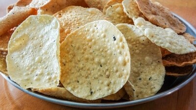 Roasted Papad: Papads can be roasted in the microwave or on a skillet for a healthy snack. You can sprinkle some chaat masala or cumin powder for flavour. (Shutterstock) Roasted Papad: Papads can be roasted in the microwave or on a skillet for a healthy snack. You can sprinkle some chaat masala or cumin powder for flavour. (Shutterstock)