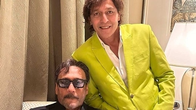 Chunky Panday wore a green jacket as he posed with Jackie Shroff at the wedding. Chunky Panday wore a green jacket as he posed with Jackie Shroff at the wedding.