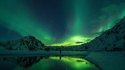 Aurora Borealis: Also known as the Northern Lights, this phenomenon is caused by charged particles from the sun colliding with gases in Earth's atmosphere, creating colourful lights that dance across the sky. The best places to see them are in the Arctic regions of Norway, Iceland, and Finland. (Unsplash) Aurora Borealis: Also known as the Northern Lights, this phenomenon is caused by charged particles from the sun colliding with gases in Earth's atmosphere, creating colourful lights that dance across the sky. The best places to see them are in the Arctic regions of Norway, Iceland, and Finland. (Unsplash)