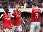 Arsenal's Bukayo Saka celebrates scoring their fourth goal with Kieran Tierney and Granit Xhaka 