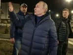 Russian President Vladimir Putin speaking with people at a newly built neighborhood during his visit to Mariupol in Russian-controlled Donetsk region. Russian President Vladimir Putin speaking with people at a newly built neighborhood during his visit to Mariupol in Russian-controlled Donetsk region.
