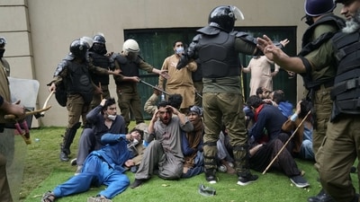 Imran Khan’s supporters managed to take control of his residence late Saturday night when the Pakistan Tehreek-e-Insaf (PTI) chairman returned from Islamabad. (AP) Imran Khan’s supporters managed to take control of his residence late Saturday night when the Pakistan Tehreek-e-Insaf (PTI) chairman returned from Islamabad. (AP)