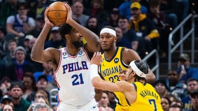 Philadelphia 76ers center Joel Embiid (21) looks to pass the ball while  Indiana Pacers guard Andrew Nembhard (2) defends in the first quarter at Gainbridge Fieldhouse. (USA TODAY Sports)