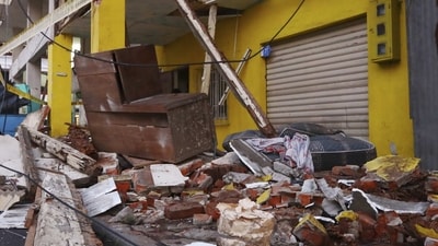 Debris from collapsed homes are scattered on a street after an earthquake shook Machala, Ecuador. (AP) Debris from collapsed homes are scattered on a street after an earthquake shook Machala, Ecuador. (AP)
