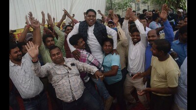 Employees of the power department celebrate breakthrough in the talks between their representatives and the state government in Lucknow, in George Town, Prayagraj on Sunday. (HT photo) Employees of the power department celebrate breakthrough in the talks between their representatives and the state government in Lucknow, in George Town, Prayagraj on Sunday. (HT photo)