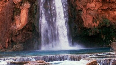 Havasu Falls in the Grand Canyon, Arizona, is pictured in 1993. Tourists hoping to see world-famous Arizona waterfalls forced out by flooding (The Arizona Republic via AP, File) Havasu Falls in the Grand Canyon, Arizona, is pictured in 1993. Tourists hoping to see world-famous Arizona waterfalls forced out by flooding (The Arizona Republic via AP, File)
