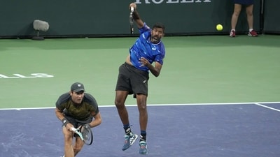Rohan Bopanna, of India, right, returns a shot next to teammate Matthew Ebden, of Australia (AP) Rohan Bopanna, of India, right, returns a shot next to teammate Matthew Ebden, of Australia (AP)