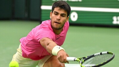 Indian Wells, CA, USA; Carlos Alcaraz (ESP) hits a shot in the semi-final match defeating Jannik Sinner (ITA) in the BNP Paribas Open at the Indian Wells Tennis Garden (USA TODAY Sports/Reuters)