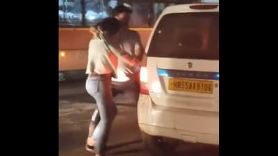 Screengrab of viral video showing a woman being shoved into a cab by a man, identified as her 'friend' by the police. (Twitter.)