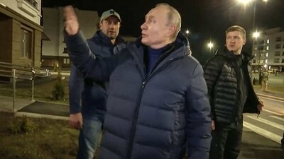 Russian President Vladimir Putin speaking with people at a newly built neighborhood during his visit to Mariupol in Russian-controlled Donetsk region. (AFP) Russian President Vladimir Putin speaking with people at a newly built neighborhood during his visit to Mariupol in Russian-controlled Donetsk region. (AFP)