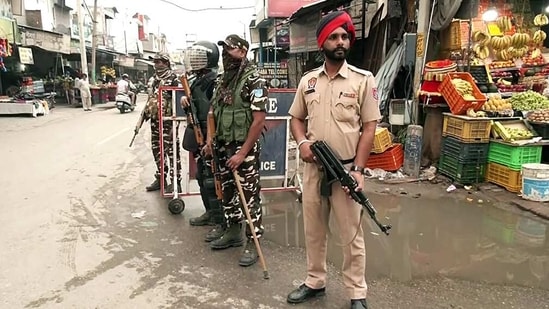 Paramilitary personnel stand guard at Mehatpur village after the arrest of associates of Waris Punjab De chief Amritpal Singh in Jalandhar on Saturday. (ANI)