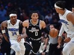  Los Angeles Clippers guard Russell Westbrook (0) moves the ball up court against Orlando Magic center Wendell Carter Jr. (34) and forward Paolo Banchero (5) during the first half at Crypto.com Arena.